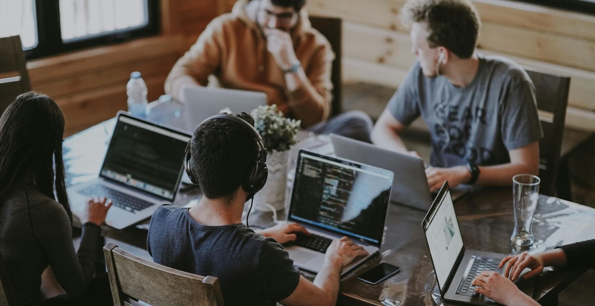 A team sitting around a table exploring ideas together